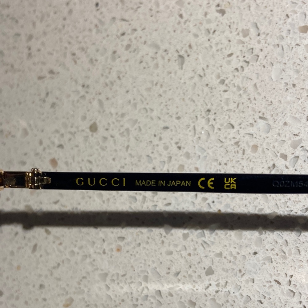 Gucci GG0130OZ 001 Elegant Black and Gold Eyewear - Picture 5 of 9